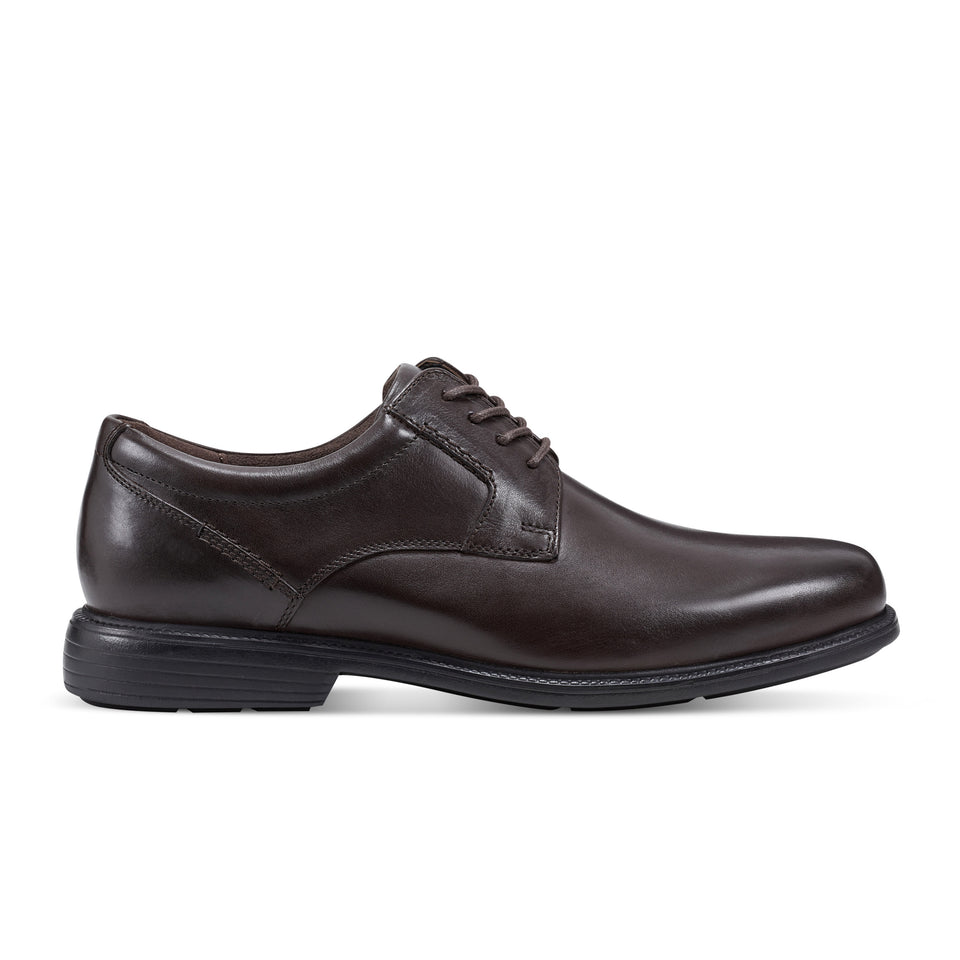 Rockport Charles Road shoe shown as a footwear example; no sole lift modification is pictured